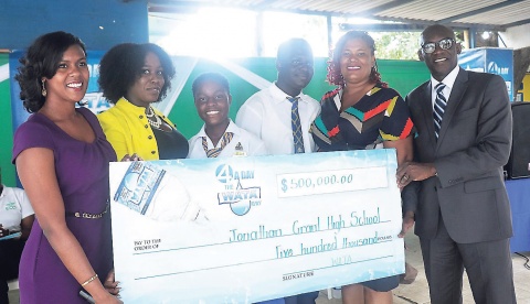 The WATA team presents a $500,000 cheque